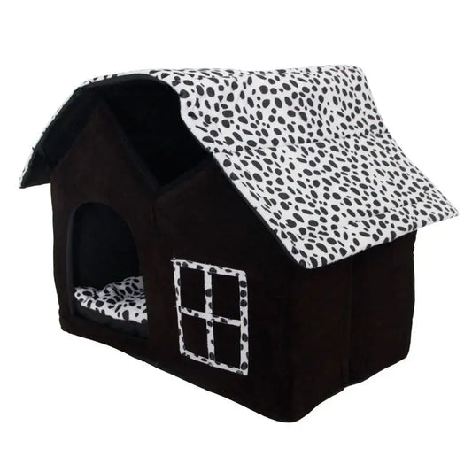 Cozy pet house with a black and white spotted design, perfect for dogs and cats to relax and sleep comfortably.